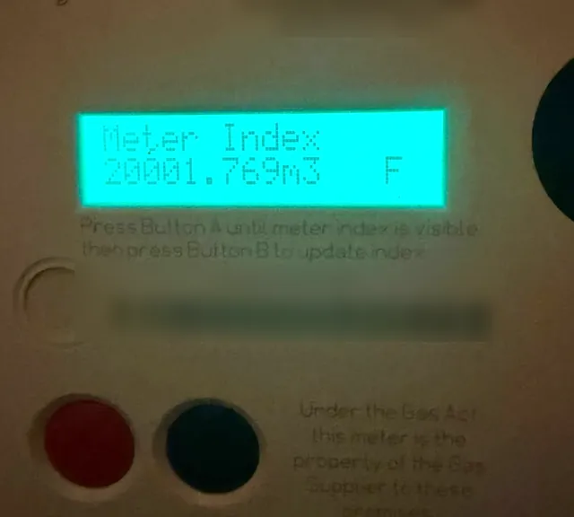 A gas meter display showing the meter index reading, with serial numbers blurred.
