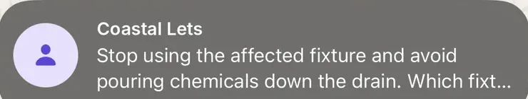 A phone notification from the landlord's WhatsApp Business number asking the tenant which fixture is blocked.